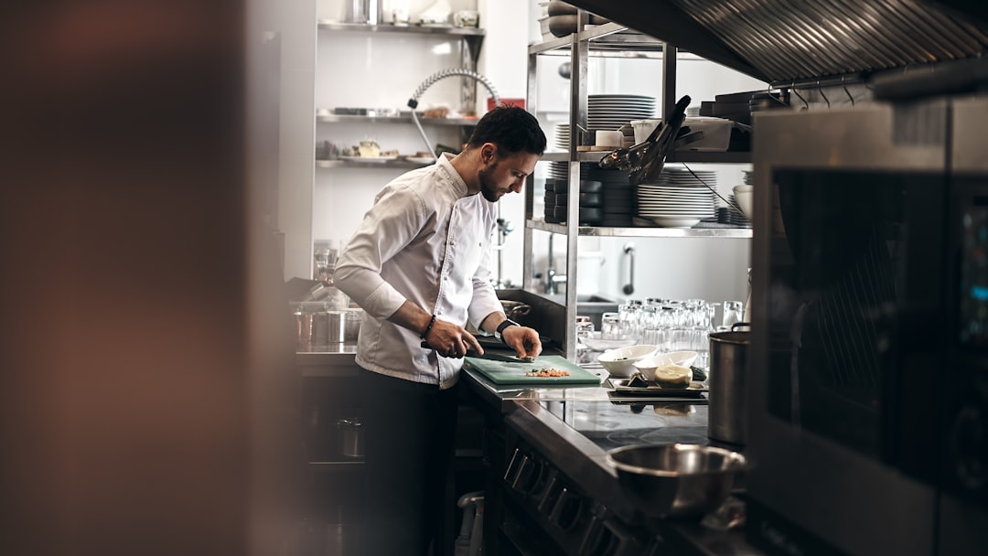 Fine dining chef plating a dish