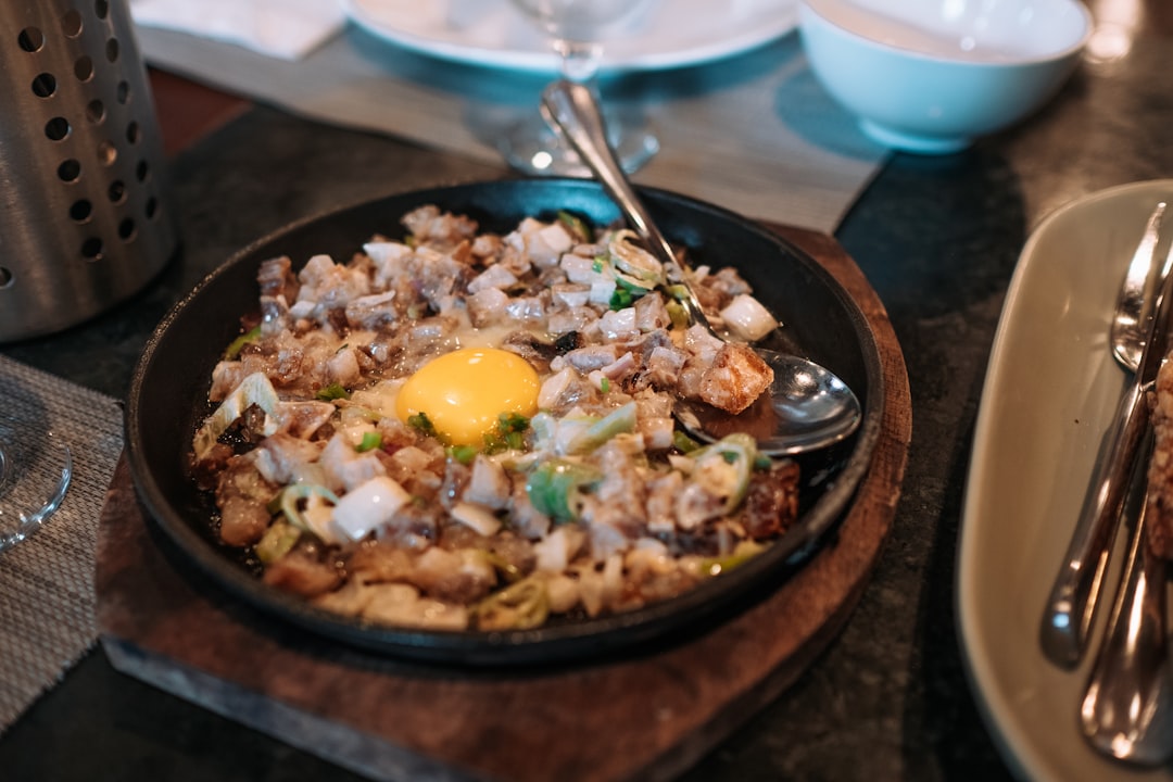 Filipino chicken sisig on sizzling hot plate
