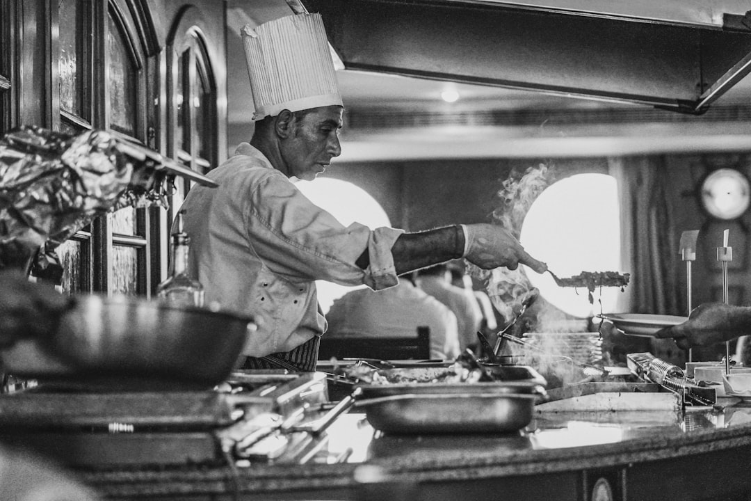 Indian chef preparing curry dish