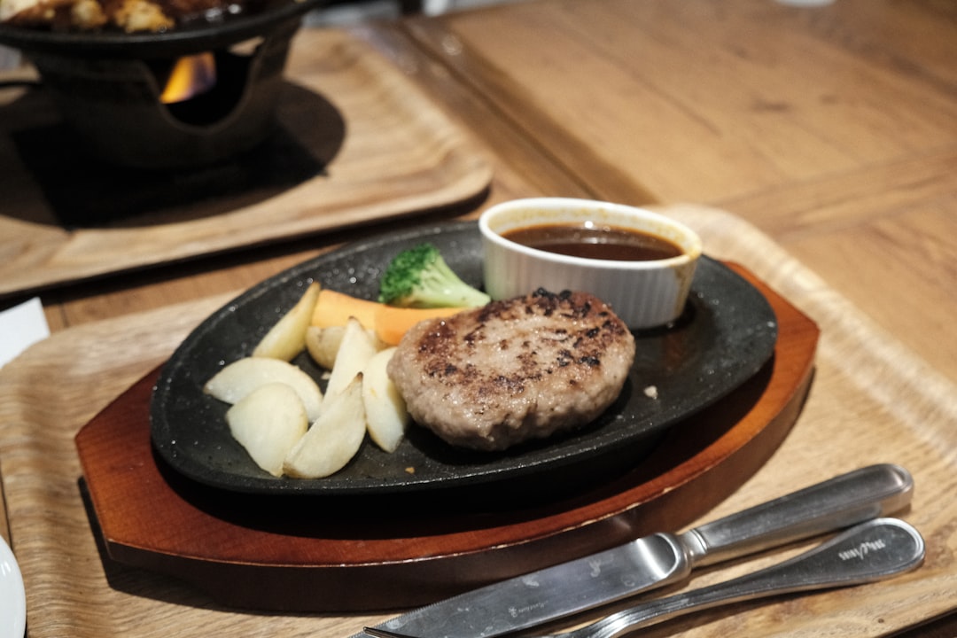Japanese hamburg steak on sizzling plate with sauce