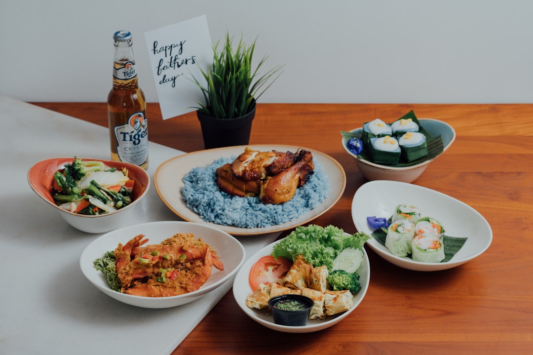 Vibrant spread of iconic Singapore hawker dishes showcasing the city-state's multicultural food heritage